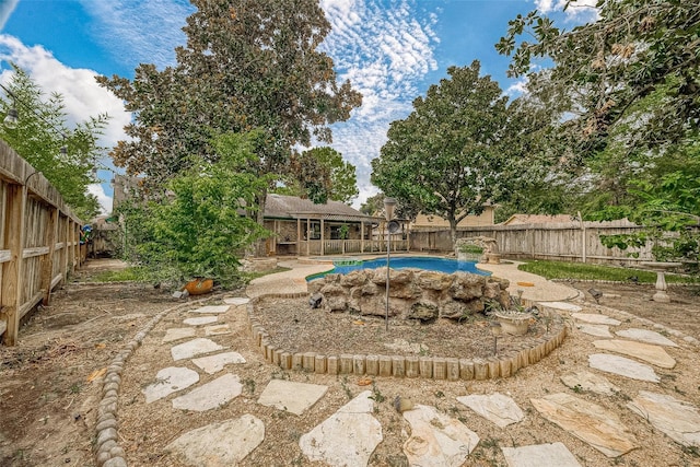 exterior space with a fenced in pool and a fenced backyard