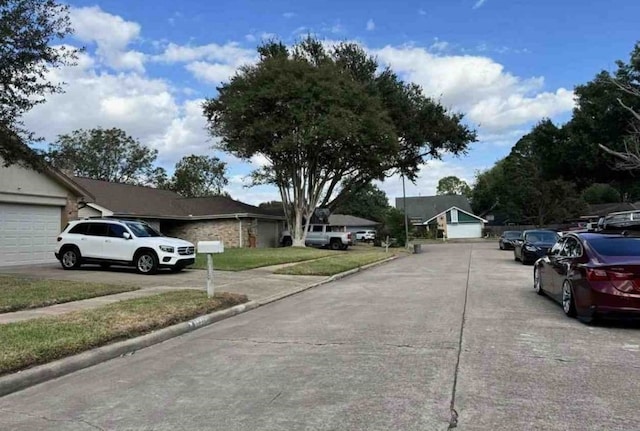 view of road with curbs and sidewalks