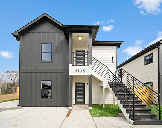 view of front of house featuring stairway and board and batten siding