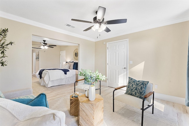 bedroom with baseboards, visible vents, a ceiling fan, ornamental molding, and light wood-type flooring