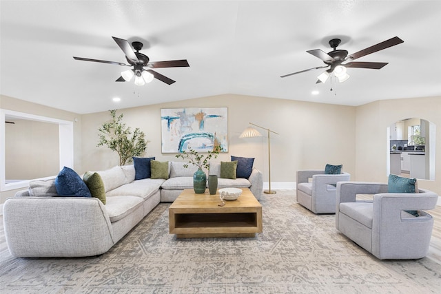 living room with ceiling fan, arched walkways, and recessed lighting