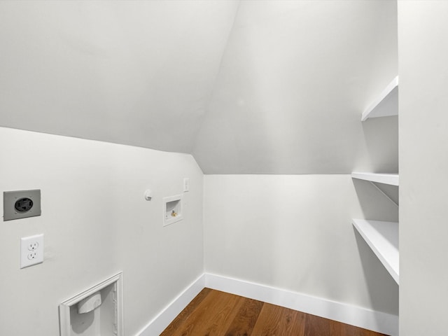 washroom featuring hookup for a washing machine, hookup for a gas dryer, hookup for an electric dryer, wood finished floors, and baseboards