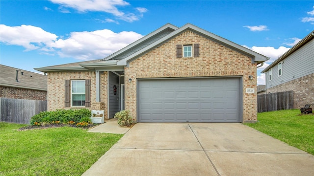 view of front of property featuring concrete driveway, an attached garage, fence, a front lawn, and brick siding