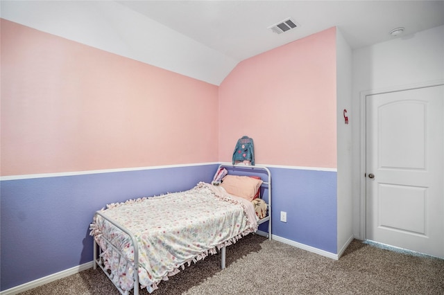 bedroom with lofted ceiling, carpet flooring, visible vents, and baseboards