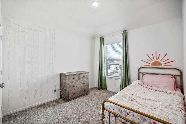 bedroom with carpet and baseboards