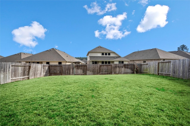 view of yard featuring a fenced backyard