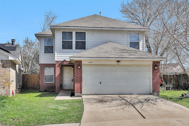 traditional home featuring a garage, brick siding, fence, concrete driveway, and a front lawn