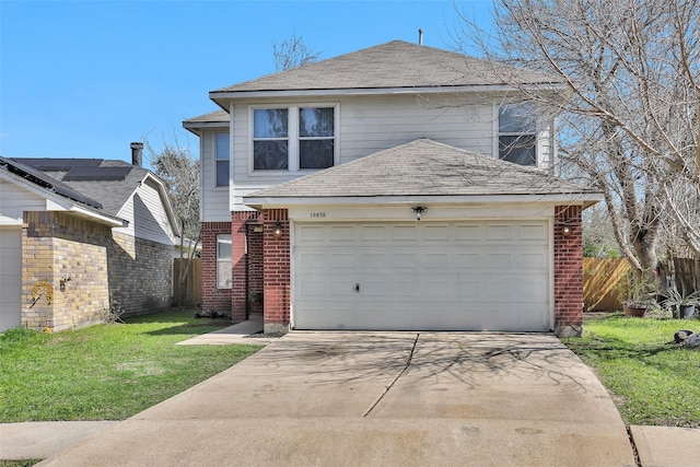 traditional-style home featuring an attached garage, brick siding, fence, driveway, and a front lawn