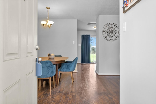 dining area with a notable chandelier, baseboards, visible vents, and dark wood-style flooring