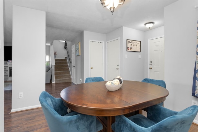 dining space with stairs, baseboards, and dark wood-type flooring