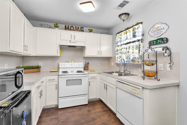 kitchen with white appliances, light countertops, a sink, and under cabinet range hood