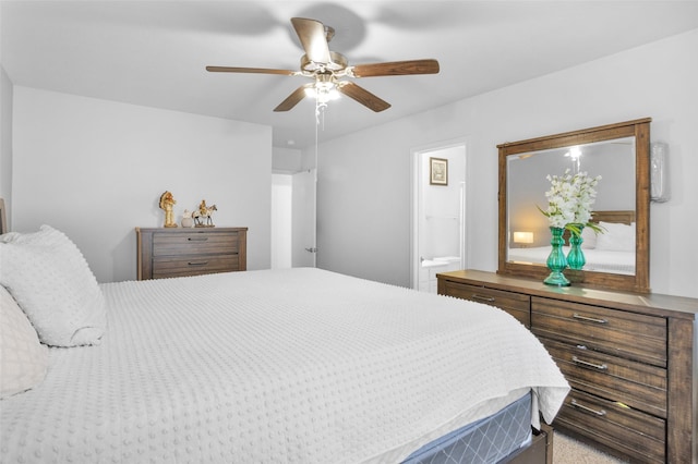 bedroom featuring ensuite bathroom and a ceiling fan