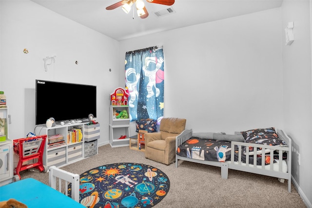 playroom with visible vents, carpet floors, a ceiling fan, and baseboards