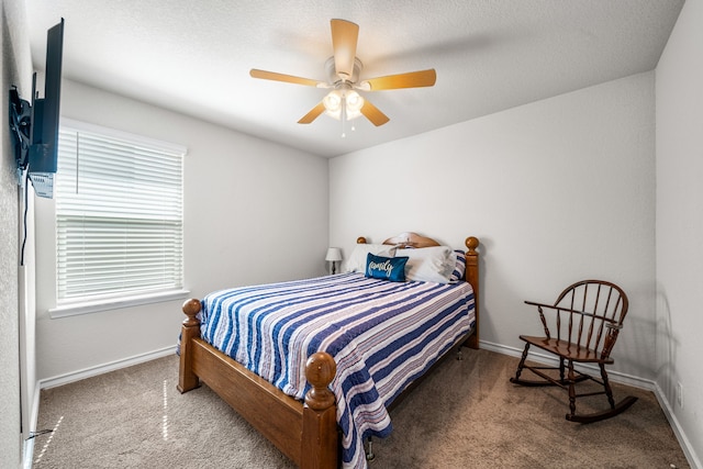 bedroom featuring carpet, baseboards, and ceiling fan