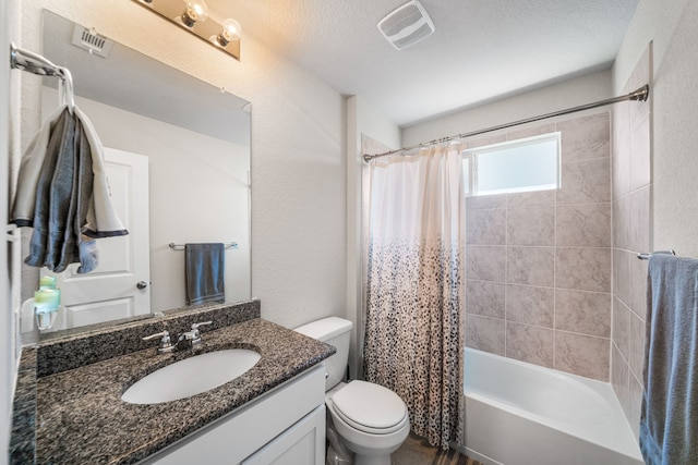 bathroom with shower / bath combination with curtain, visible vents, vanity, and toilet