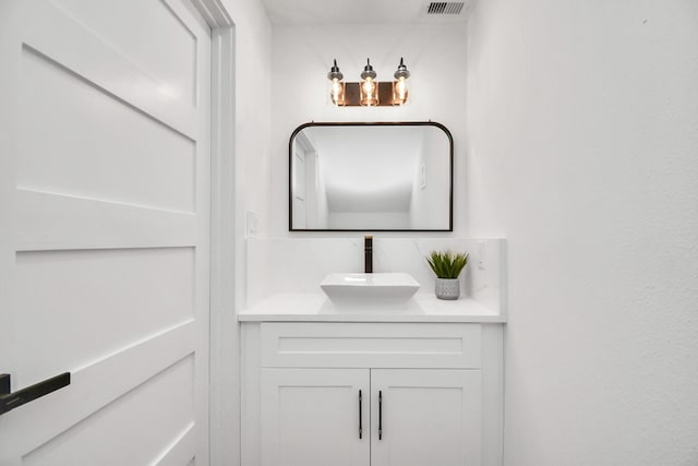 bathroom featuring visible vents and vanity