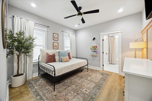 bedroom with connected bathroom, recessed lighting, a ceiling fan, baseboards, and light wood-style floors