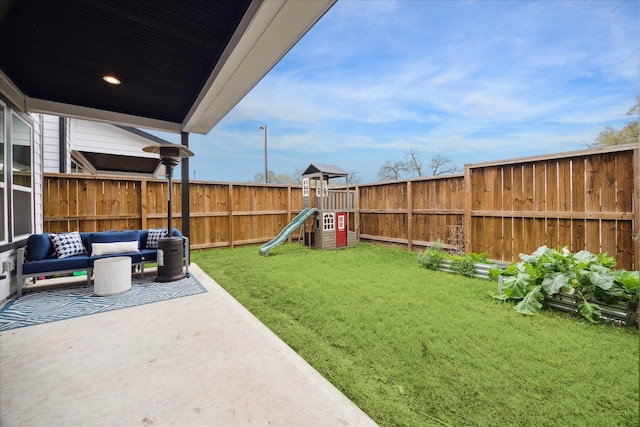 view of yard featuring a fenced backyard, an outdoor hangout area, a playground, and a patio