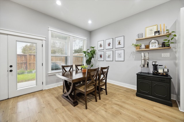 dining space with baseboards, recessed lighting, and light wood-style floors