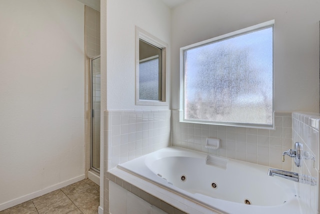 full bathroom with an enclosed shower, a jetted tub, baseboards, and tile patterned floors