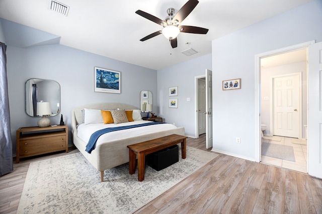 bedroom featuring a ceiling fan, baseboards, visible vents, and light wood finished floors