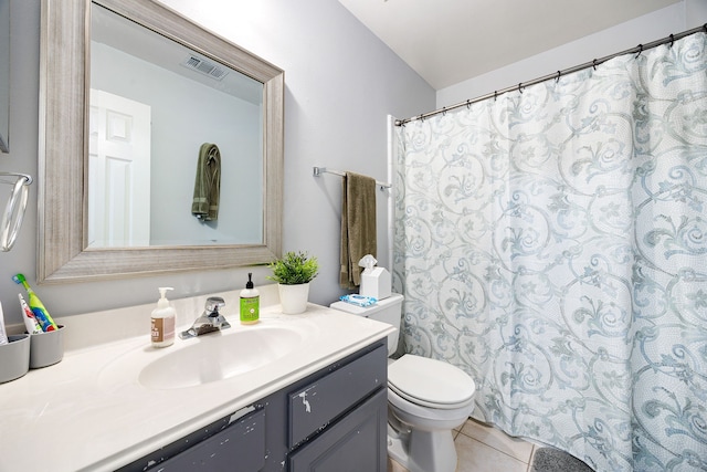 bathroom with visible vents, toilet, a shower with curtain, tile patterned flooring, and vanity