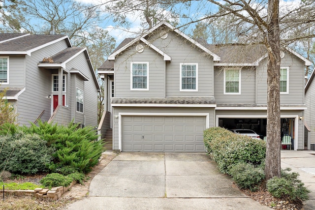 view of front facade with a garage and concrete driveway