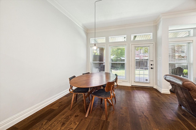 dining space with dark wood-style floors, crown molding, and baseboards