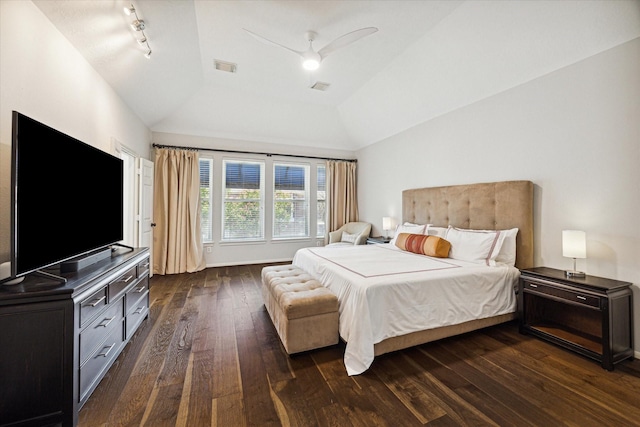 bedroom with lofted ceiling, dark wood-style floors, visible vents, and a ceiling fan