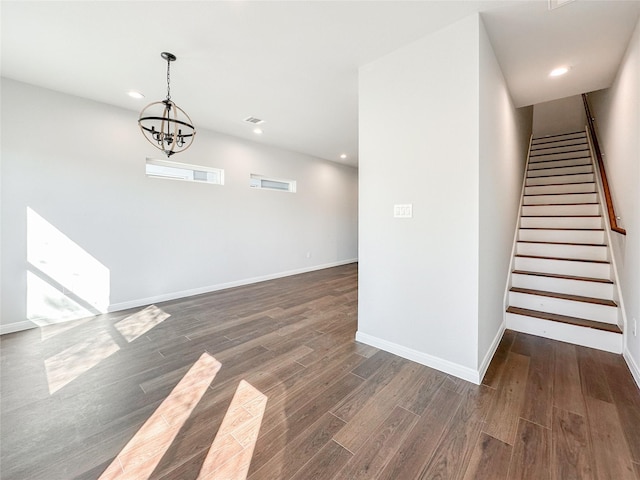 interior space featuring baseboards, stairway, dark wood-type flooring, and recessed lighting