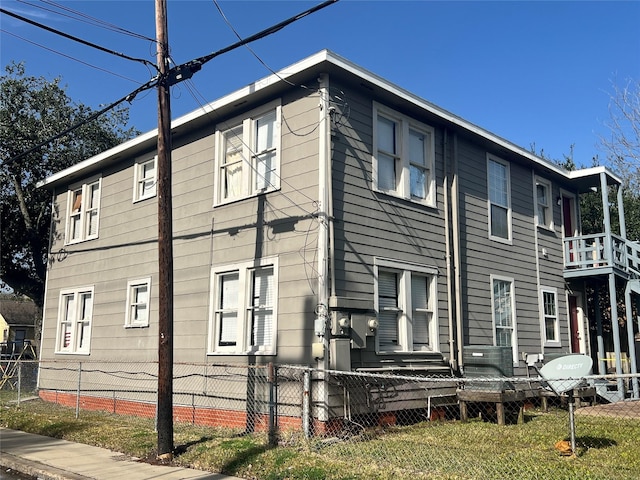 view of side of home featuring a fenced front yard