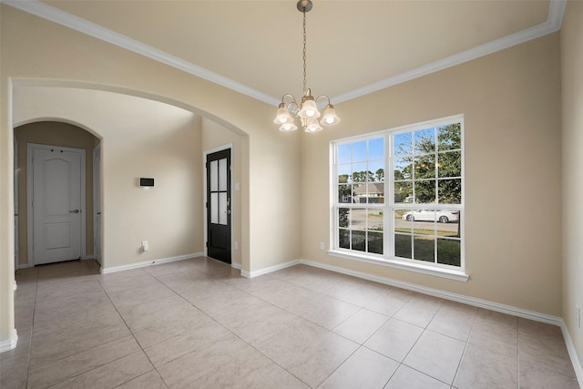 empty room featuring light tile patterned floors, baseboards, arched walkways, an inviting chandelier, and crown molding