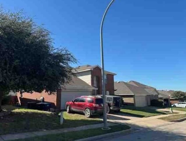 view of property exterior with an attached garage