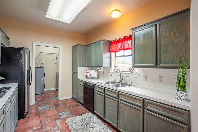 kitchen featuring stone tile floors, light countertops, a sink, stainless steel fridge, and dishwasher