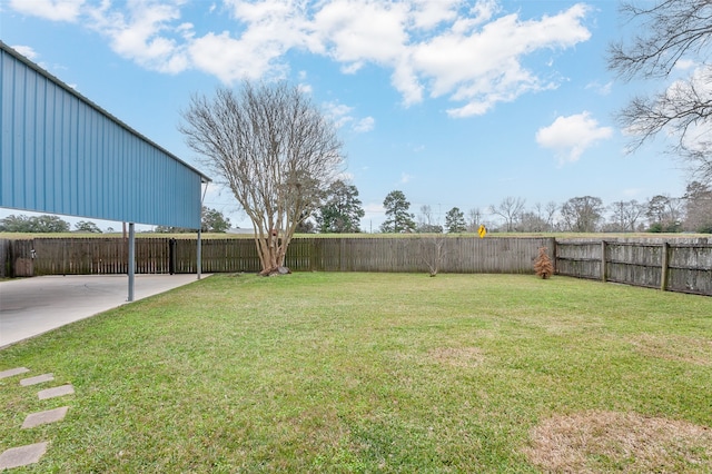 view of yard featuring a fenced backyard and a patio