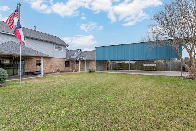 exterior space featuring a carport and fence