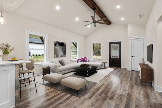 living area with dark wood-type flooring, visible vents, beamed ceiling, and high vaulted ceiling