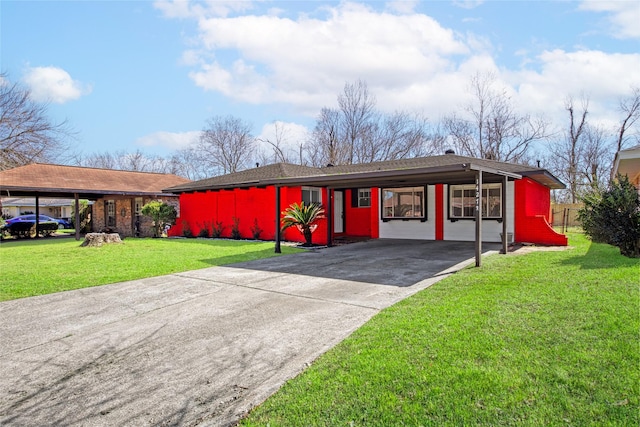 view of front of property with driveway, a front lawn, and an attached carport