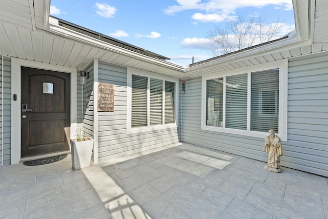 property entrance with a patio area