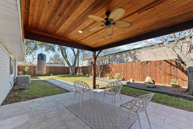 view of patio with ceiling fan, cooling unit, and a fenced backyard