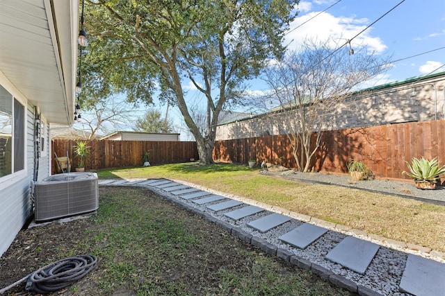 view of yard featuring a fenced backyard and central air condition unit