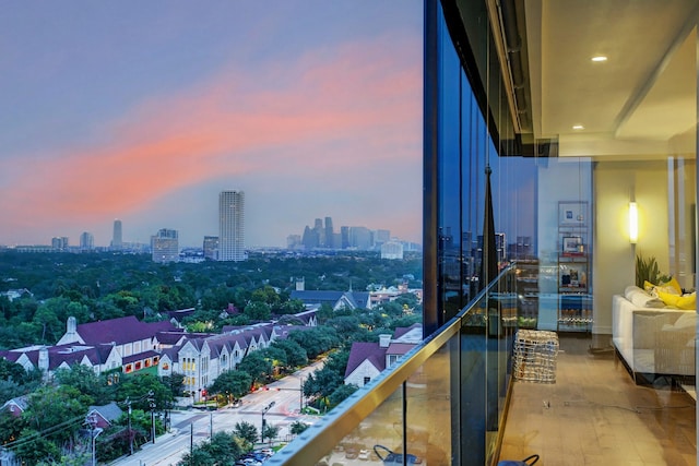 balcony at dusk with a view of city