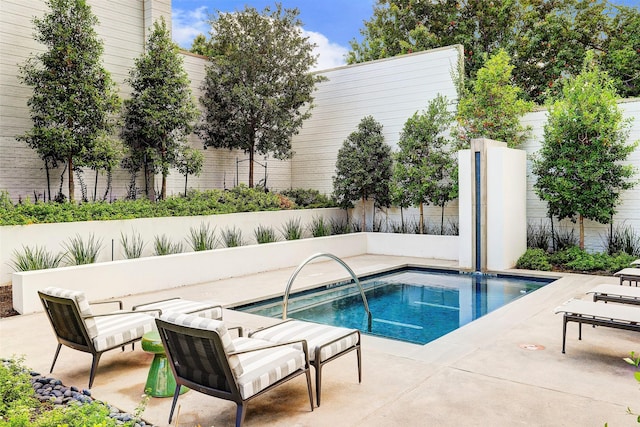 view of pool featuring a patio area