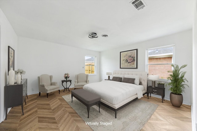 bedroom featuring visible vents and baseboards