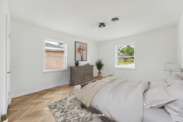 bedroom featuring visible vents and baseboards