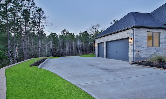 exterior space featuring a garage and concrete driveway