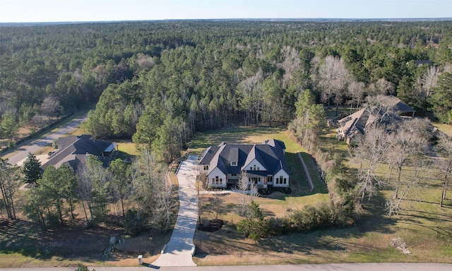 aerial view with a wooded view