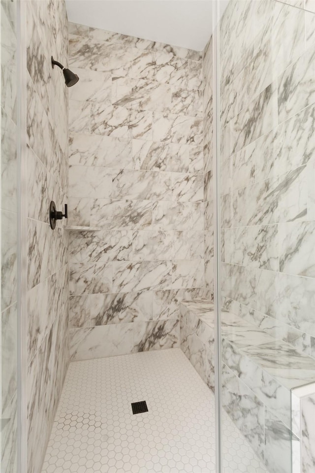 bathroom with a shower stall