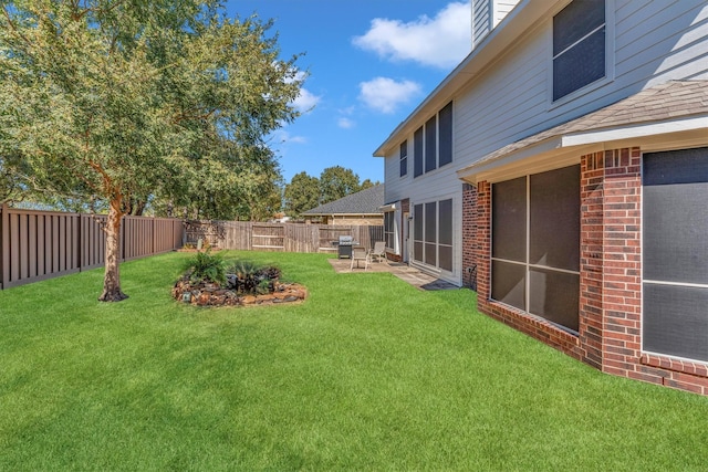 view of yard with a patio area and a fenced backyard