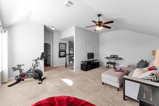 living room with light colored carpet, visible vents, vaulted ceiling, and baseboards